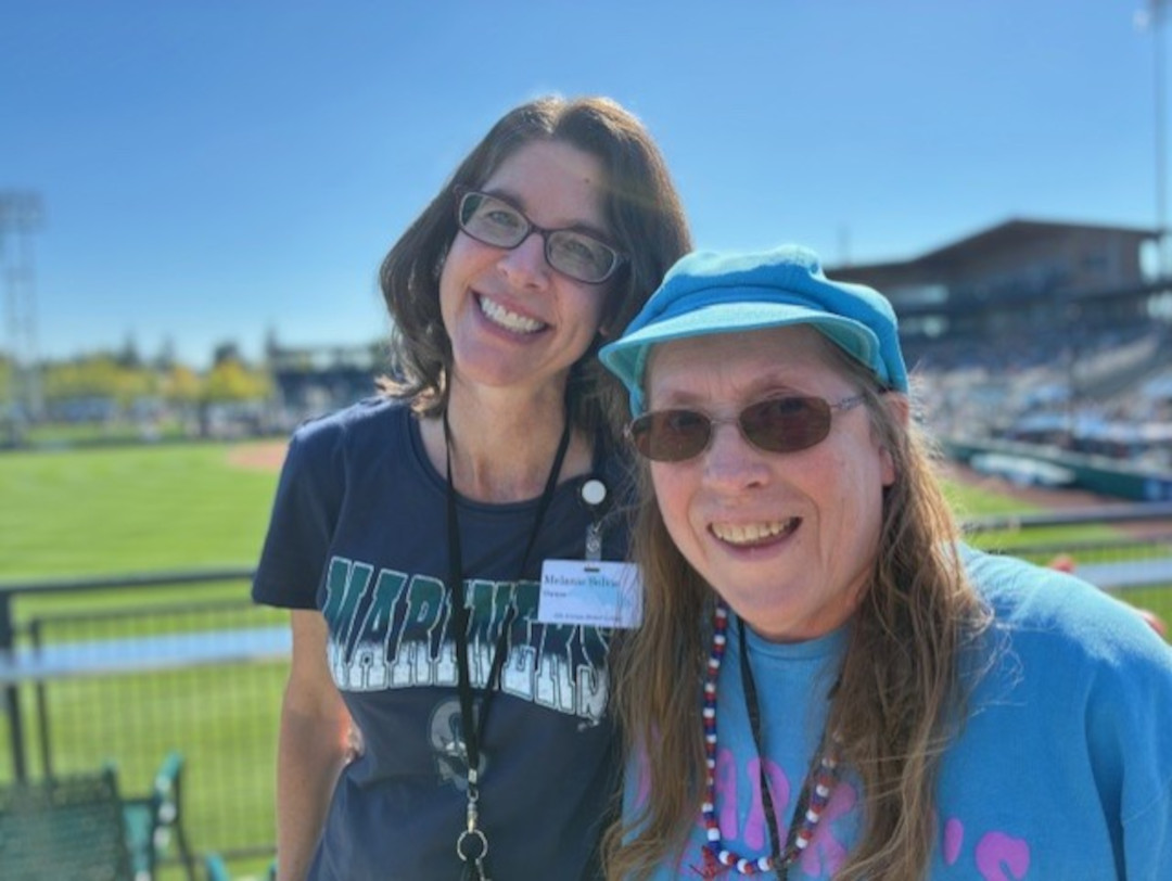 Melanie Solvie hanging out with a resident at the baseball game