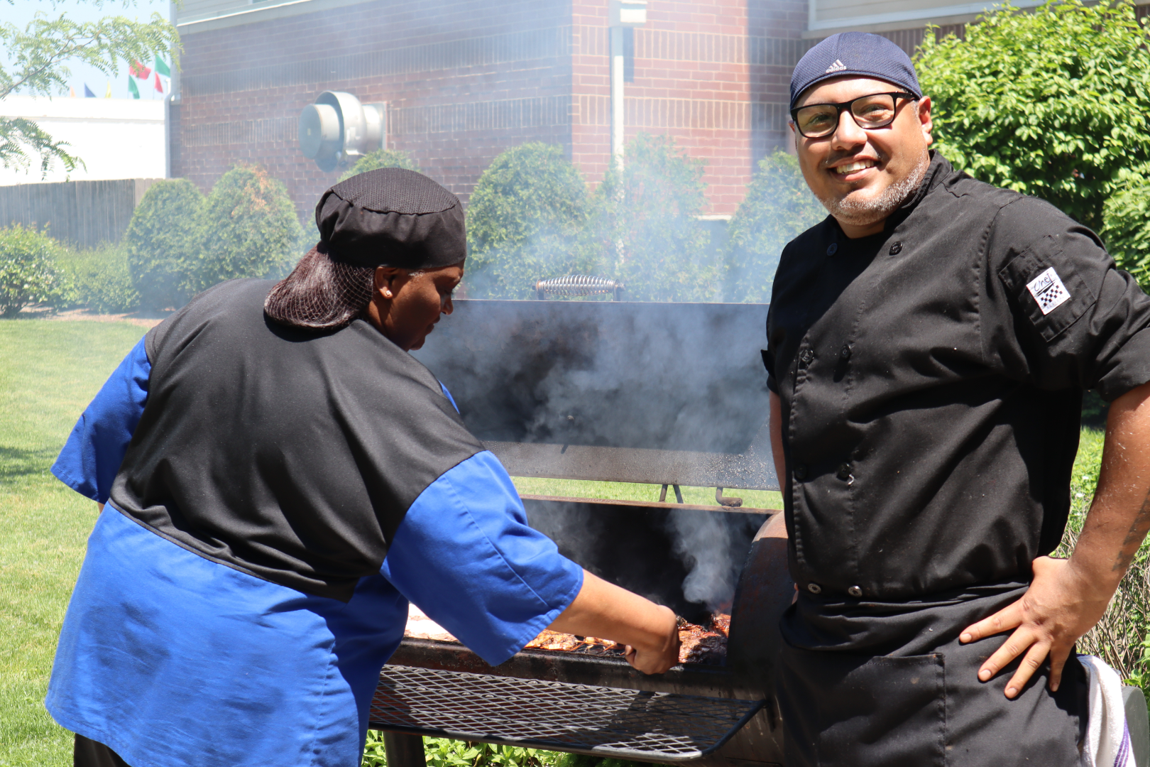 Team members at Silver Birch of Hammond cooking out for the residents