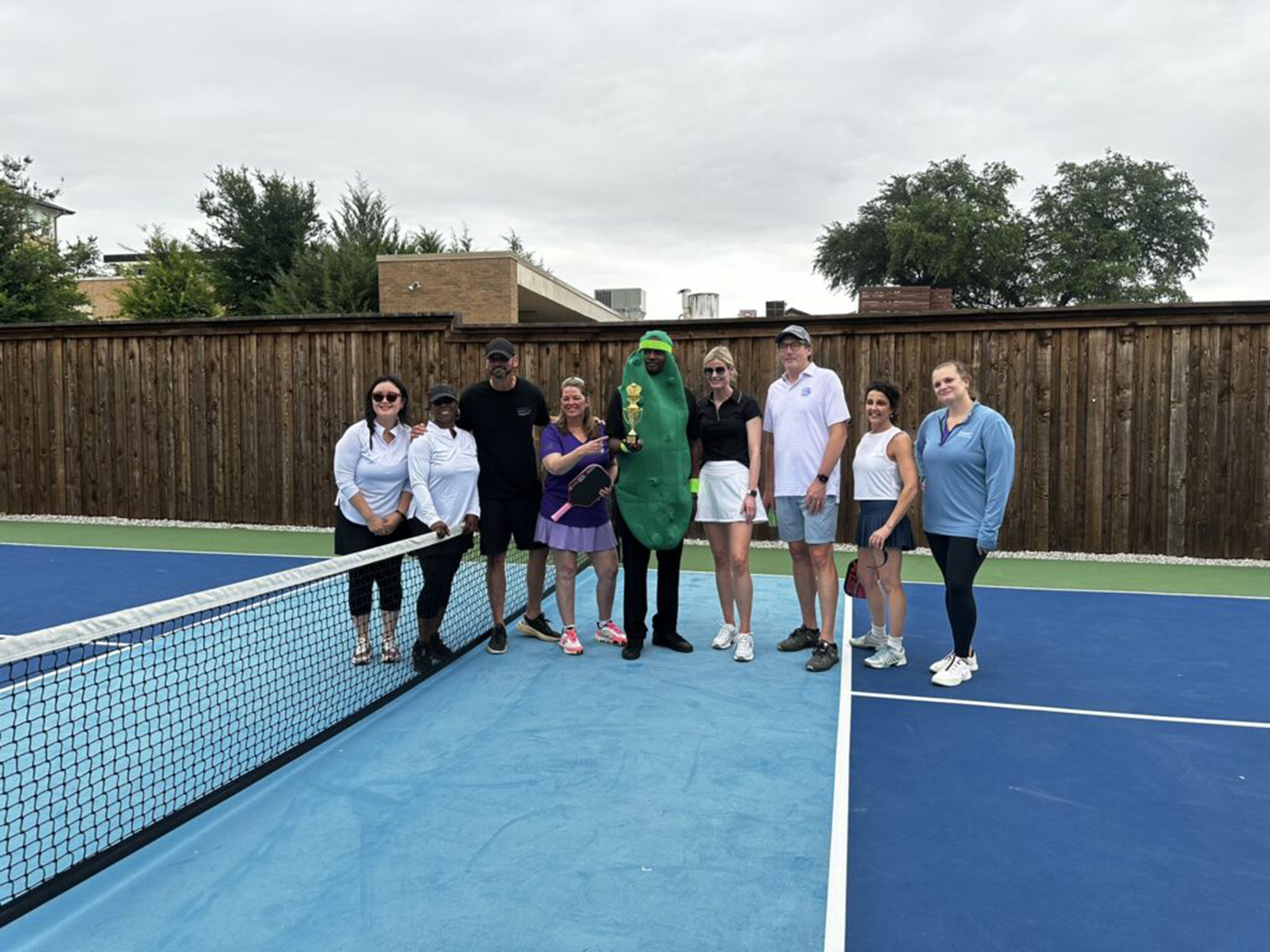 Teammates participate in a Pickle Ball tournament 