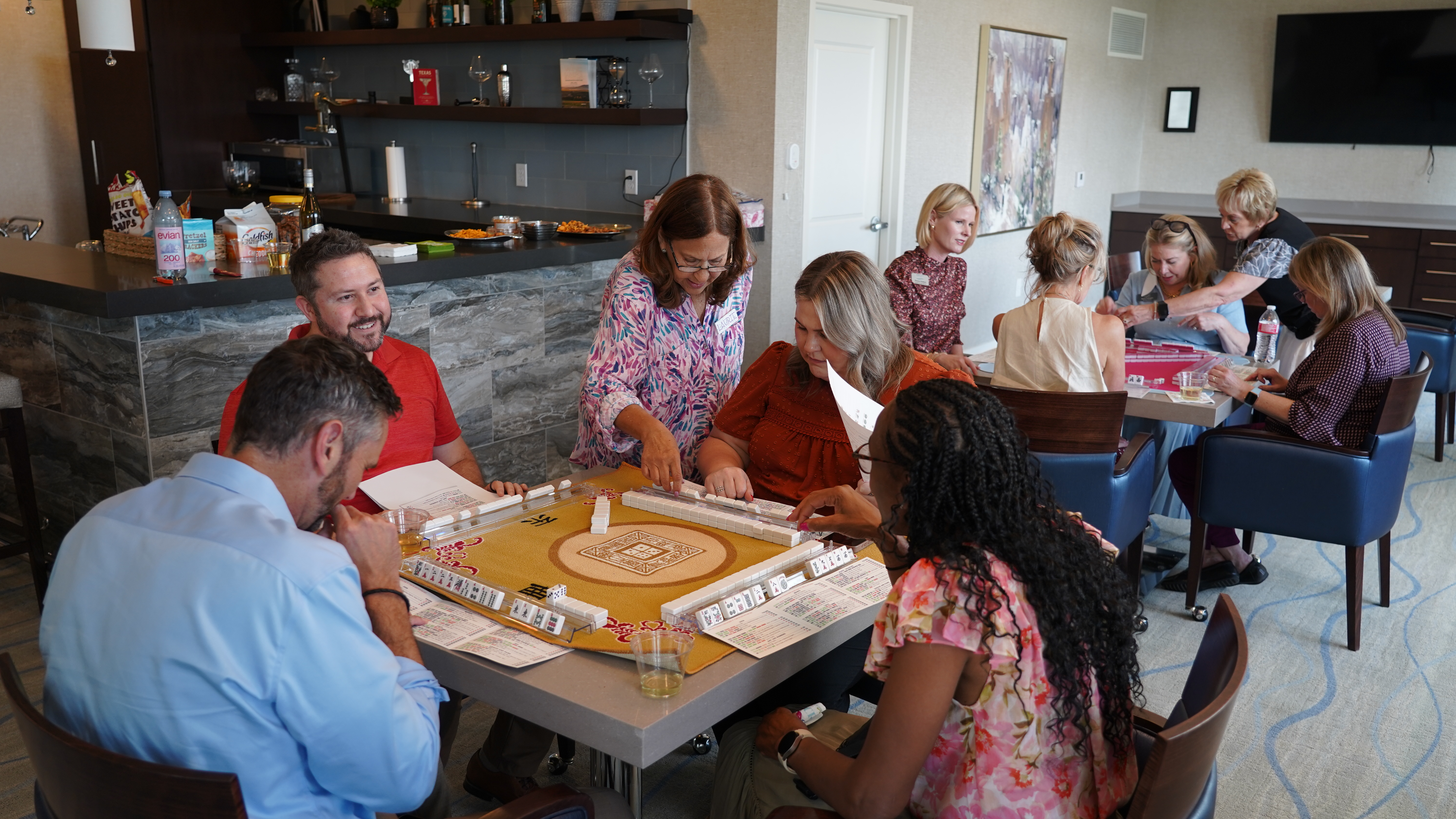 Teammates come together to learn and play Mah Jongg