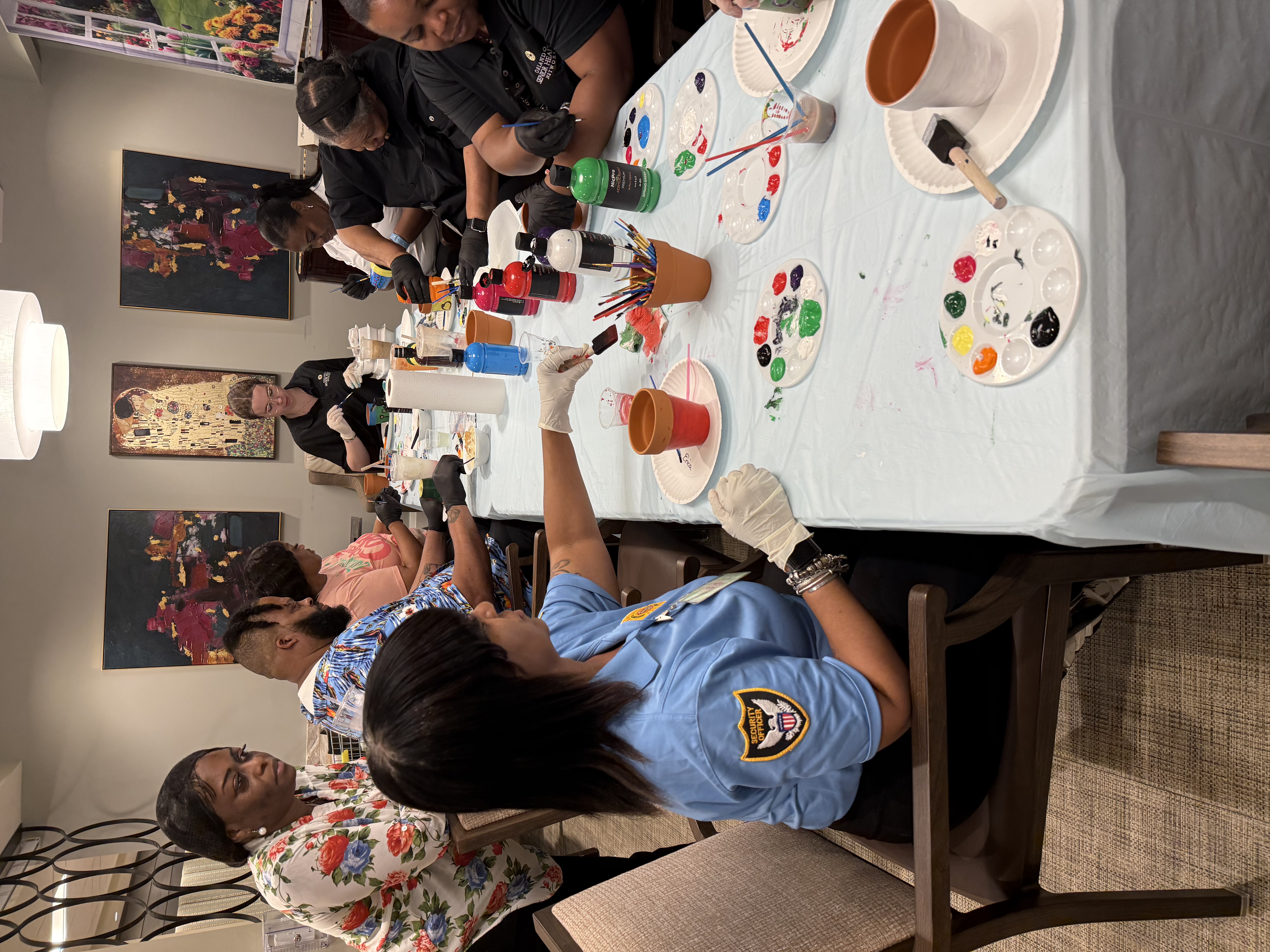OSHN team members decorating flowerpots during employee appreciation week 2026.