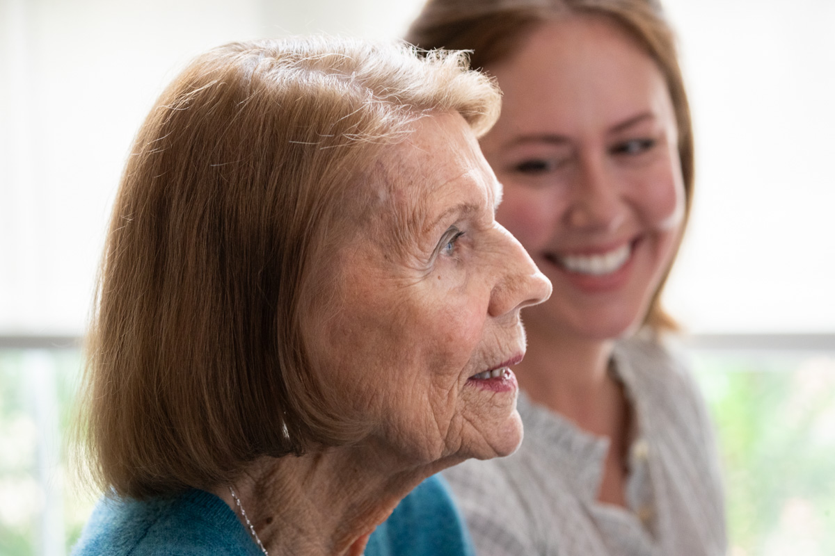 A team member playing piano with a resident