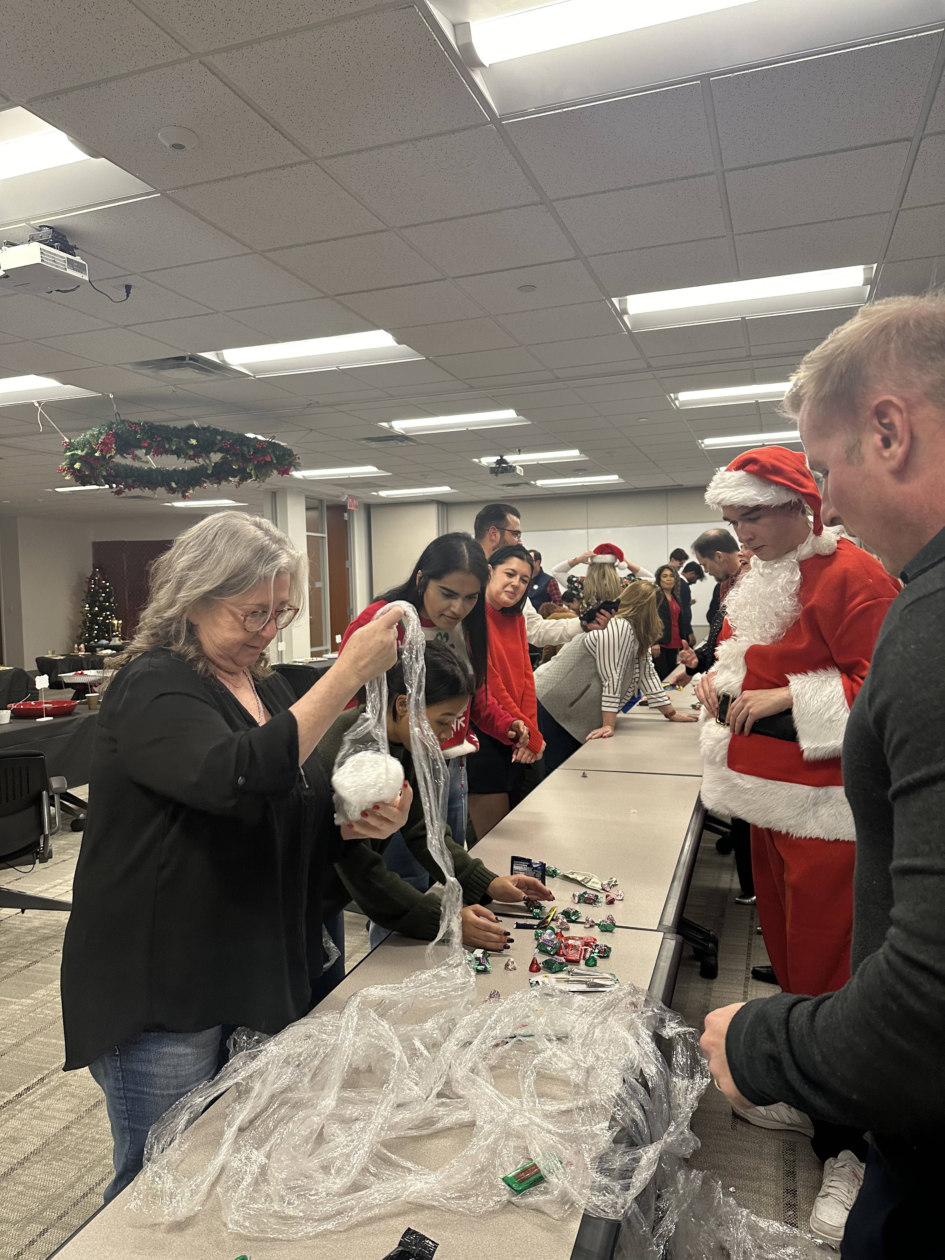 Reliant at Home annual Christmas Saran Wrap game is CRAZY FUN!