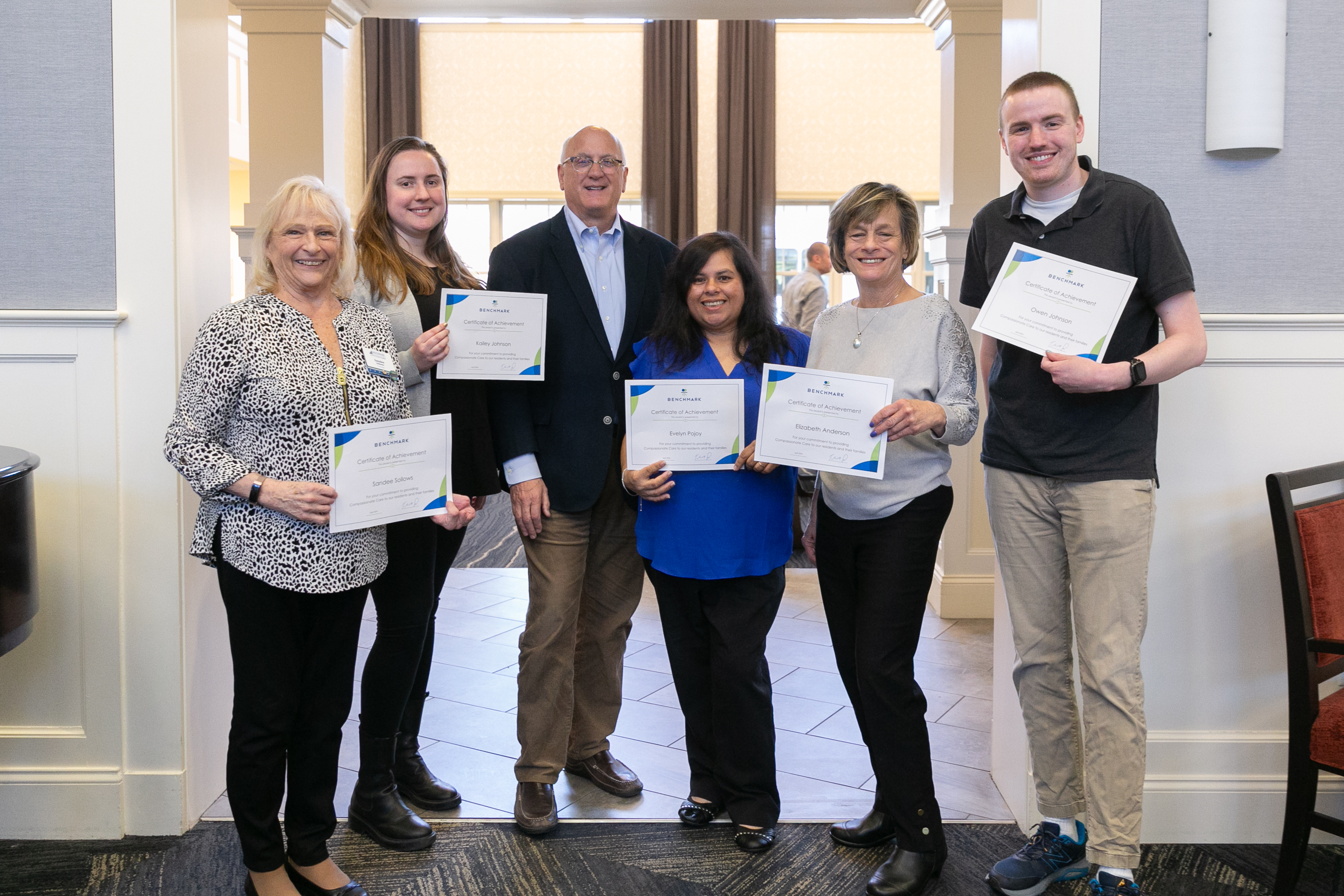 Benchmark Founder, Chairman & CEO Tom Grape celebrating associates at a Compassionate Care Giver luncheon